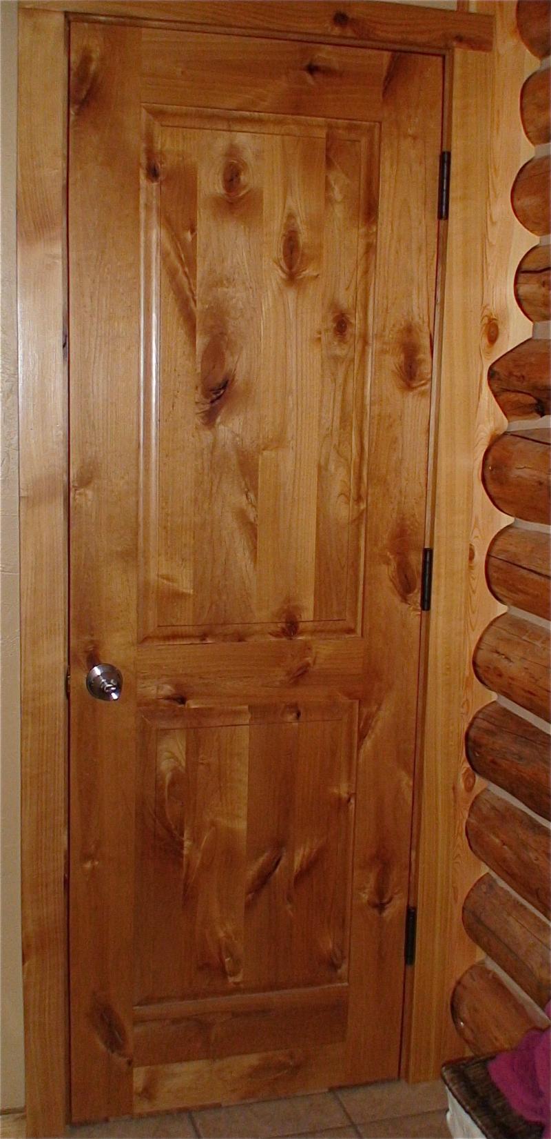 Knotty alder two panel door with raised panels