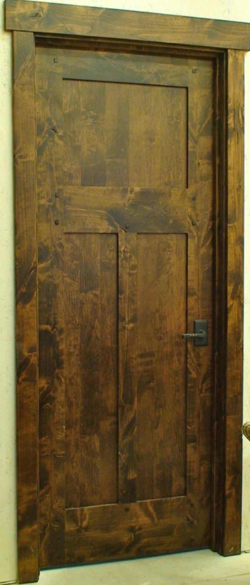 Knotty alder three panel door with flat panels