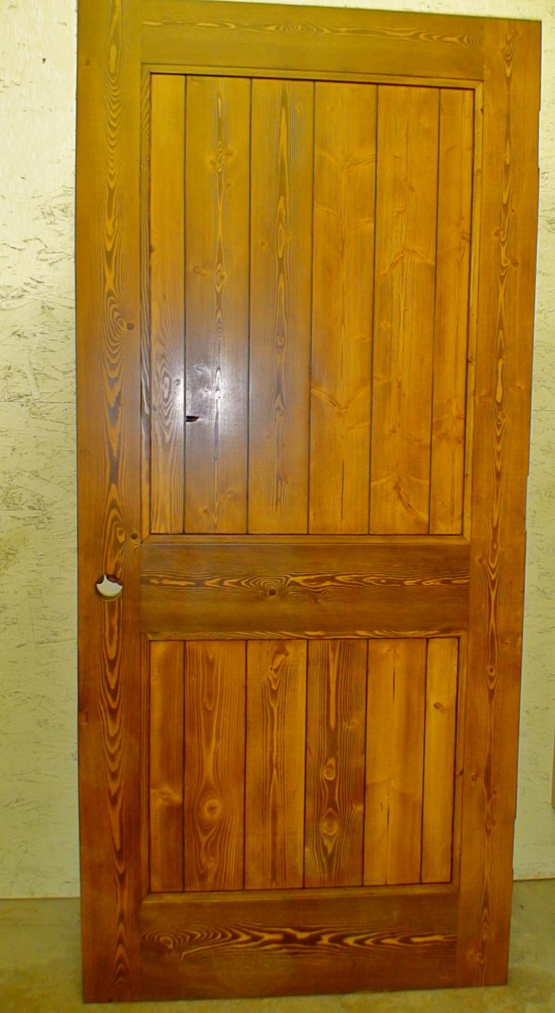 Fir two panel plank style door with applied moulding.